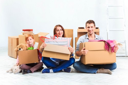 Van removal service assisting with loading and unloading furniture