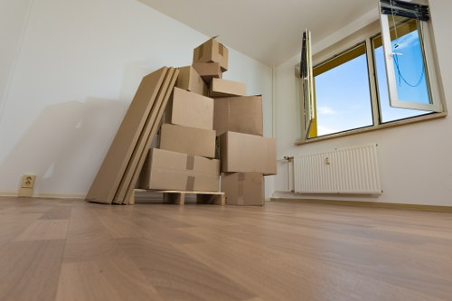 Packed moving boxes and furniture ready for transport