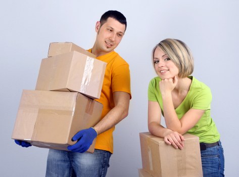 Local moving truck loaded with household furniture and boxes
