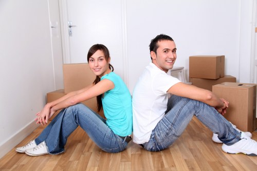 A local office removals team organizing desks and boxes for relocation