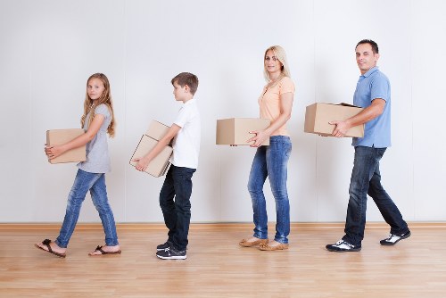 Packed household boxes and furniture ready for a local move